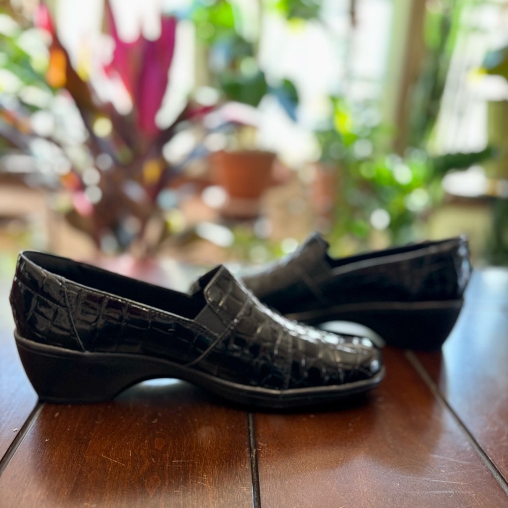 Clarks Women's May Marigold slip-on loafers in black croco patent leather.